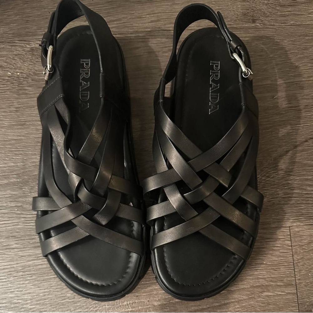 Authentic PRADA flat form, sling back caged leather sandals.